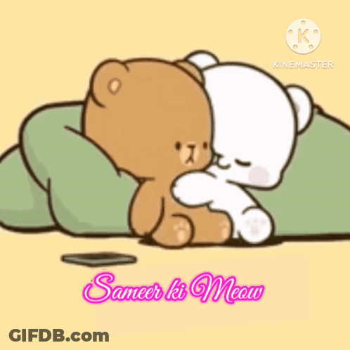 A Couple Of Teddy Bears Laying Next To Each Other On A Blanket . GIF