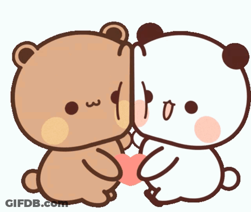 A Couple Of Teddy Bears Sitting Next To Each Other With One Holding A Heart GIF