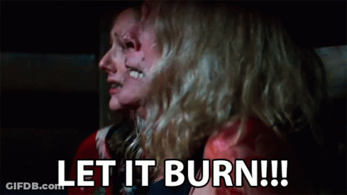 A Couple Of Women Are Sitting Next To Each Other With Their Faces Covered In Blood . GIF