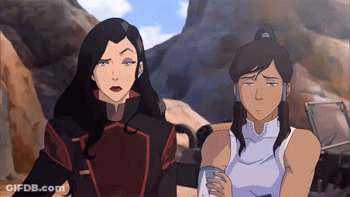 A Couple Of Women Standing Next To Each Other With One Looking Sad GIF