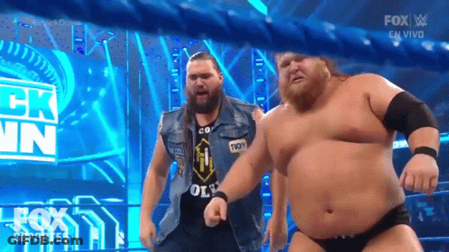 Wrestlers Dancing On Stage With Fox Logo GIF