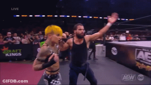 A Couple Of Wrestlers In A Ring With The Word Aew On The Bottom GIF