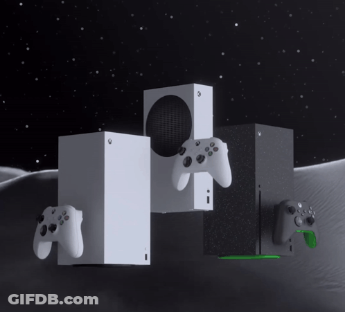 A Couple Of Xbox Consoles Sitting Next To Each Other On A Table GIF