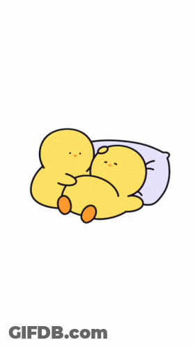 A Couple Of Yellow Ducks Laying Next To Each Other GIF