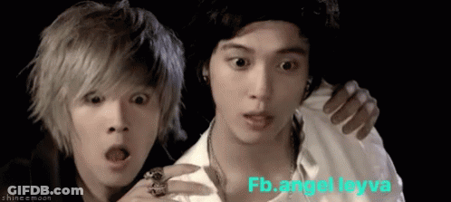 A Couple Of Young Men Standing Next To Each Other With The Words Fb.angel Leyva Written On The Bottom GIF