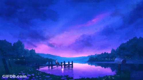A Couple Sits On A Dock Overlooking A Lake GIF