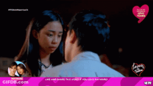 A Couple Sitting On A Ledge With The Words " Live And Share This Video If You Love Mayward " At The Top GIF