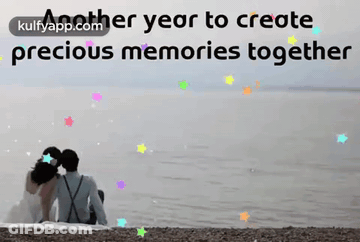 A Couple Sitting On The Beach With The Words Another Year To Create Precious Memories Together In The Background GIF