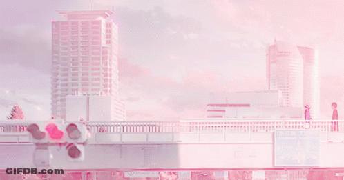 A Couple Walking Across A Bridge In Front Of A Sign That Says " Tokyo " GIF