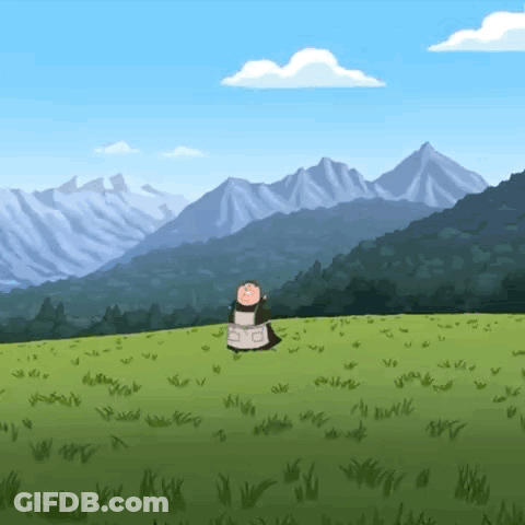 A Cow Is Standing In A Grassy Field With Mountains In The Background . GIF