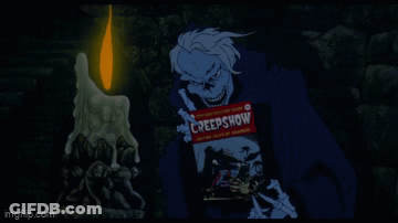 A Creepy Cartoon Character Is Holding A Creepshow Sign In Front Of A Lit Candle GIF