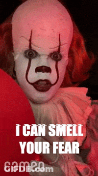 A Creepy Clown With The Words " I Can Smell Your Fear " Below It GIF