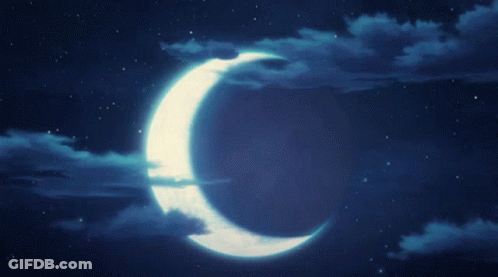 A Crescent Moon Shines Brightly In The Night Sky GIF
