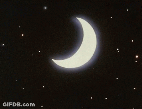 A Crescent Moon With A Blue Beam Coming Out Of It In The Night Sky GIF