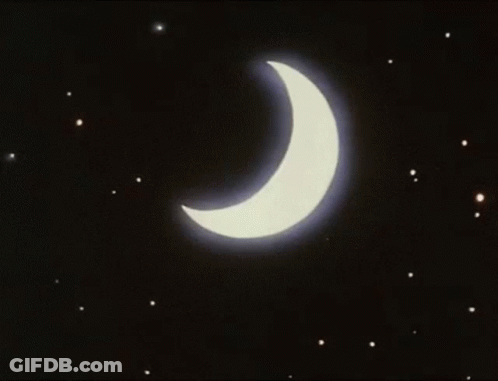 A Crescent Moon With A Blue Light Coming Out Of It In The Night Sky GIF