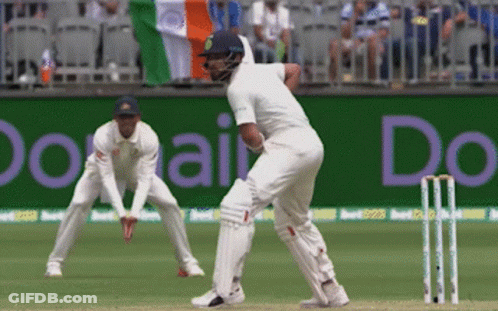 A Cricket Game Is Being Played In Front Of A Banner That Says " Do " GIF