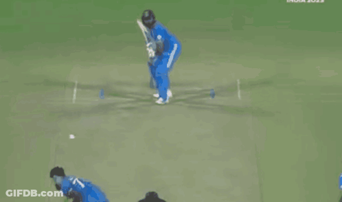 A Cricket Player In A Blue Uniform Is Playing A Game Of Cricket . GIF