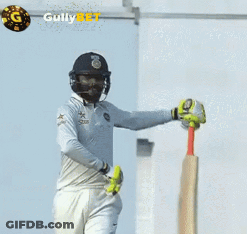 A Cricket Player Is Holding A Bat In Front Of A Gully Bet Logo GIF