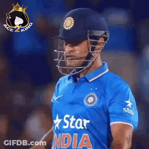 A Cricket Player Is Wearing A Helmet And A Blue Shirt That Says Star India GIF
