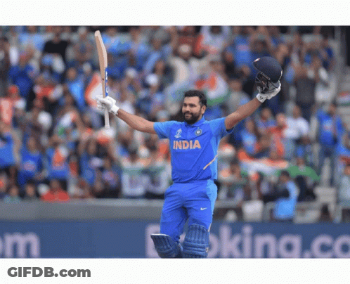 A Cricket Player Wearing A Blue India Jersey Holds His Bat In The Air GIF