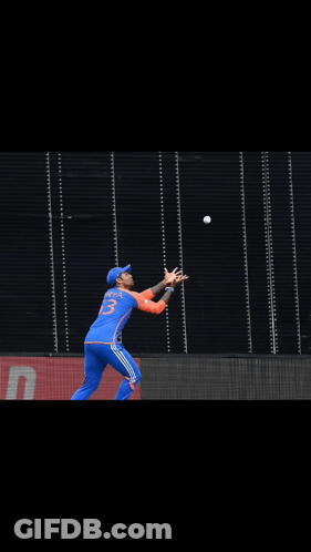 A Cricket Player Wearing A Blue Jersey With The Number 23 On It GIF