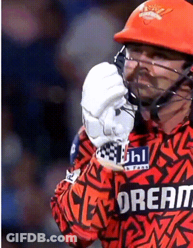 A Cricket Player Wearing A Helmet And A Jersey That Says Dream GIF
