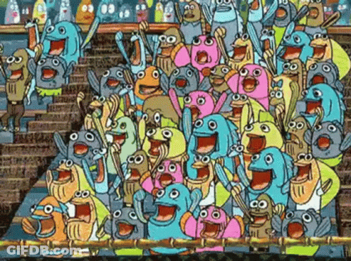 A Crowd Of Cartoon Characters Are Standing In A Stadium Cheering . GIF