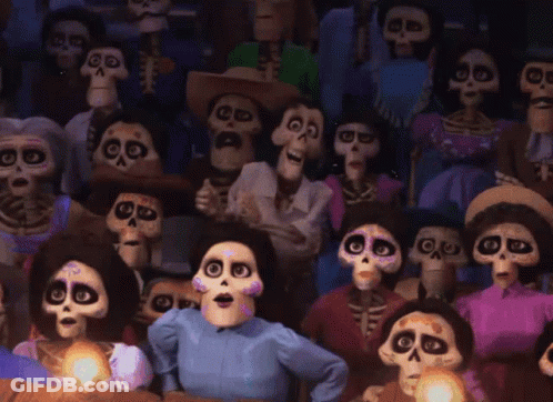 A Crowd Of Cartoon Skeletons Are Sitting In A Theater GIF