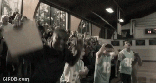 A Crowd Of People Are Gathered In A Gym Wearing Jerseys With The Numbers 30 And 13 GIF