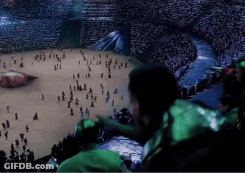 A Crowd Of People Are Gathered In A Stadium Watching A Performance GIF