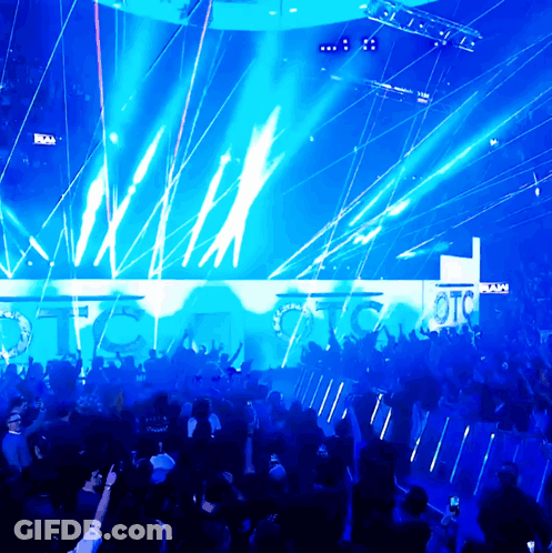 A Crowd Of People Are Gathered In Front Of A Wall That Says Otc On It GIF