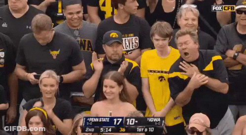 A Crowd Of People Are Watching A Penn State Vs Iowa Game GIF