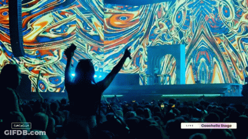 A Crowd Of People At A Concert With The Words Coachella On The Bottom GIF