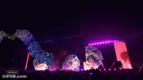 A Crowd Of People At A Music Festival With A Sign That Says Gazelle GIF