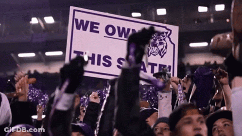 A Crowd Of People Hold Up A Sign That Says We Own This State GIF
