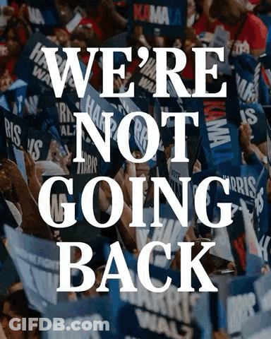 A Crowd Of People Holding Signs With The Words We 'Re Not Going Back GIF