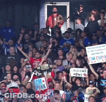 A Crowd Of People Holding Up Signs Including One That Says I Am Punk GIF