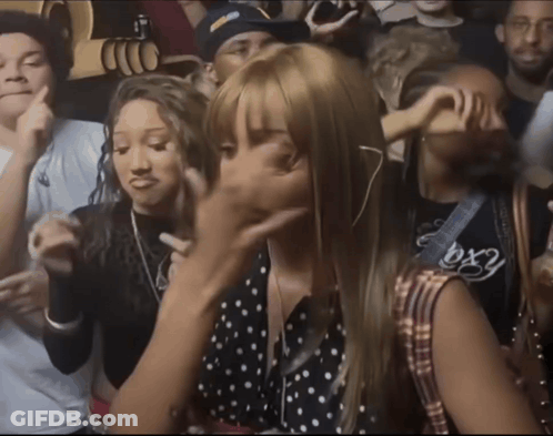 A Crowd Of People Including A Girl Wearing A Shirt That Says Bx2 GIF