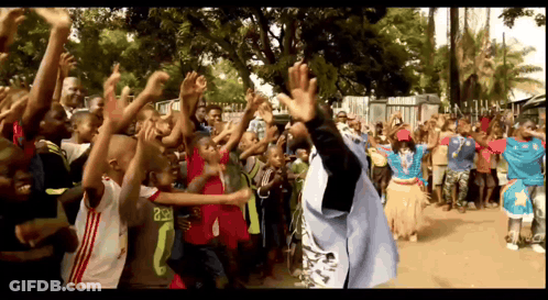 A Crowd Of People Including A Man Wearing A Shirt That Says ' Rsr ' On It GIF