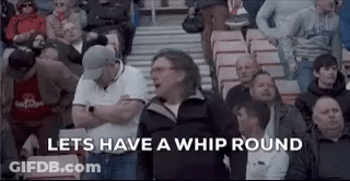 A Crowd Of People Sitting In A Stadium With The Words `` Let 'S Have A Whip Round '' Written On The Screen . GIF