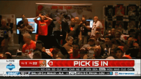A Crowd Of People Watching A Football Game With A Pick Is In Banner On The Screen GIF