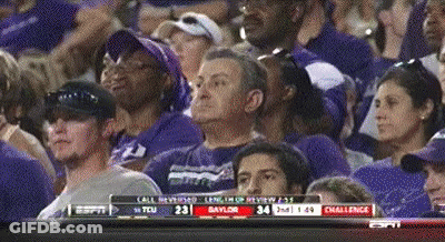 A Crowd Of People Watching A Game With Espn On The Bottom GIF