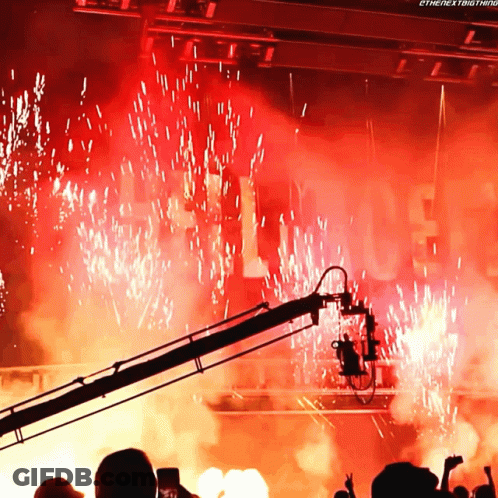 A Crowd Of People Watching Fireworks With The Words " The Next Thing " On The Bottom Right GIF