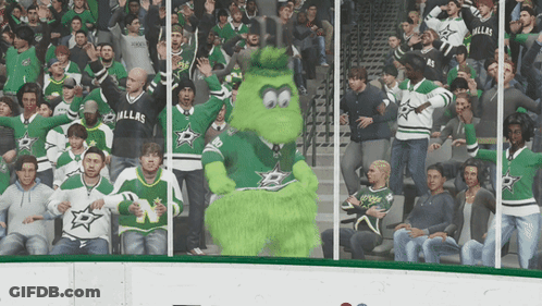 A Crowd Of People Wearing Dallas Jerseys Are Watching A Game GIF