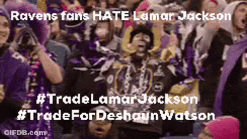 A Crowd Of Ravens Fans Are Sitting In A Stadium Watching A Football Game . GIF