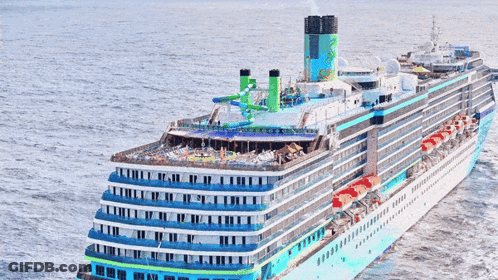 A Cruise Ship Is Floating In The Ocean And Has A Green Chimney On Top GIF