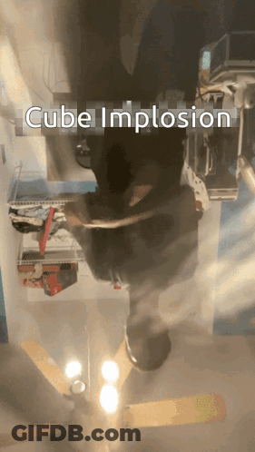 A Cube Implosion Is Displayed In A Room GIF