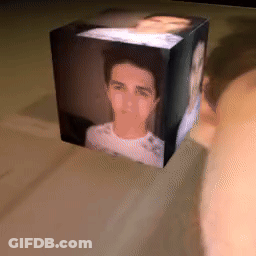 A Cube With A Picture Of A Man In It GIF