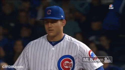 A Cubs Baseball Player Stands In The Dugout During A Game On Mlb.com GIF