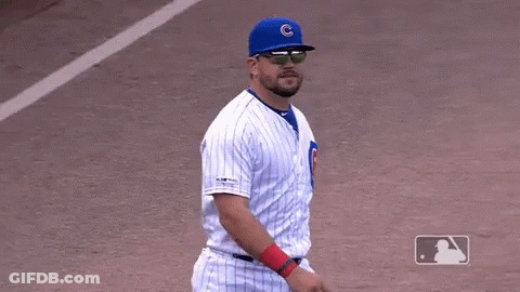 A Cubs Baseball Player Wearing Sunglasses And A Blue Hat With A C On It GIF